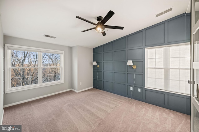 carpeted spare room with vaulted ceiling and ceiling fan