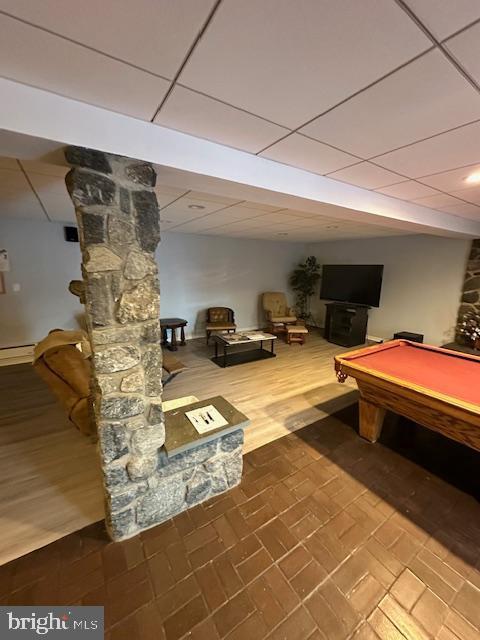 recreation room featuring a drop ceiling, billiards, and baseboard heating