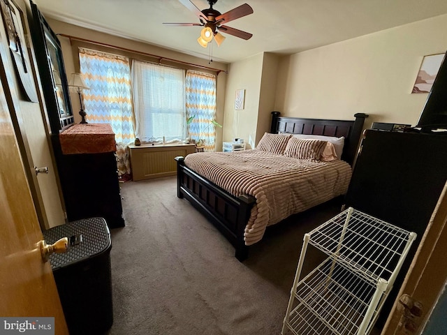 bedroom with ceiling fan and carpet floors