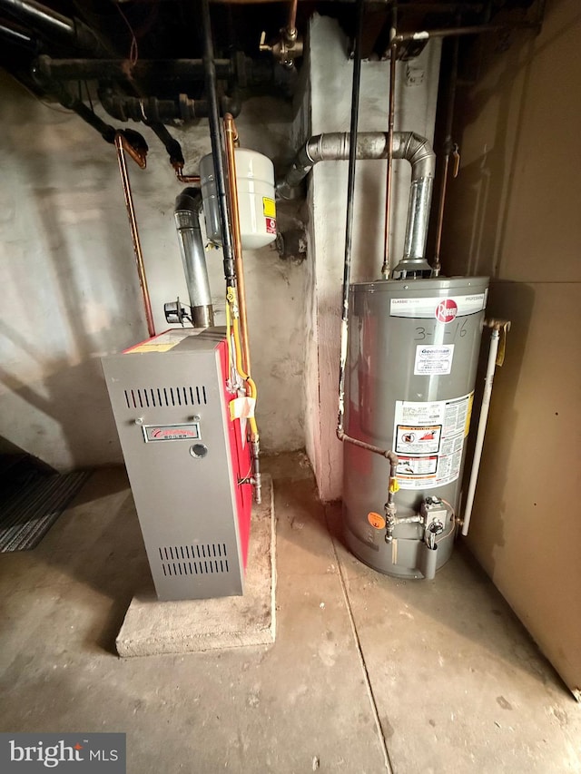 utility room featuring water heater