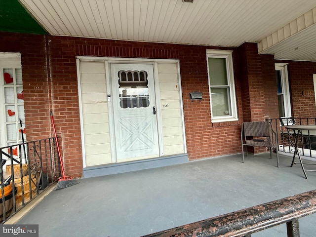 doorway to property featuring a porch