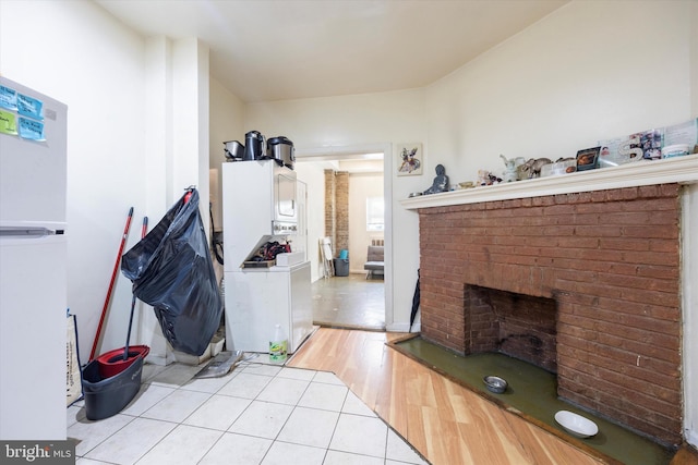 interior space featuring a fireplace and light wood-type flooring