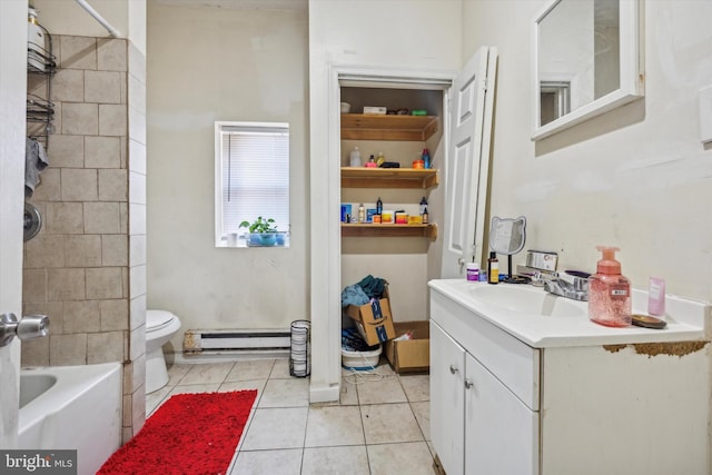 full bathroom with tile patterned flooring, vanity, tiled shower / bath combo, baseboard heating, and toilet