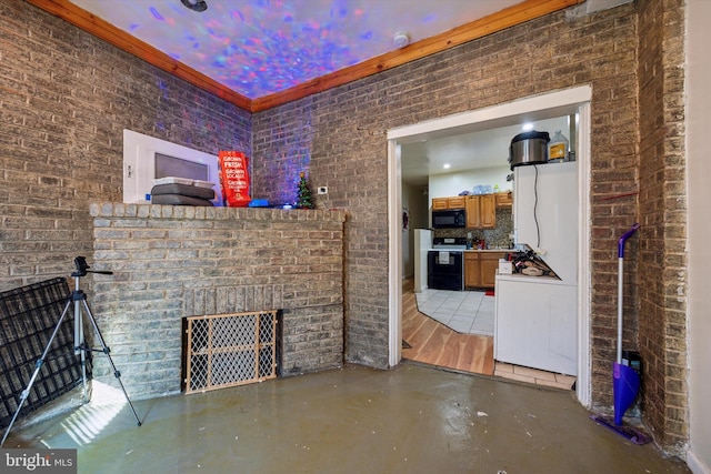 unfurnished living room featuring brick wall and concrete flooring