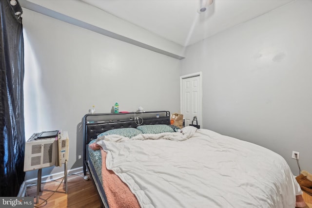 bedroom with wood-type flooring