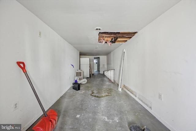 corridor with concrete floors