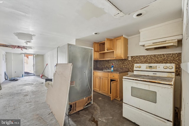 kitchen featuring backsplash, refrigerator, and white range with electric stovetop