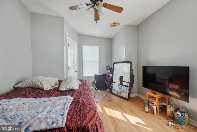 bedroom with wood-type flooring and ceiling fan