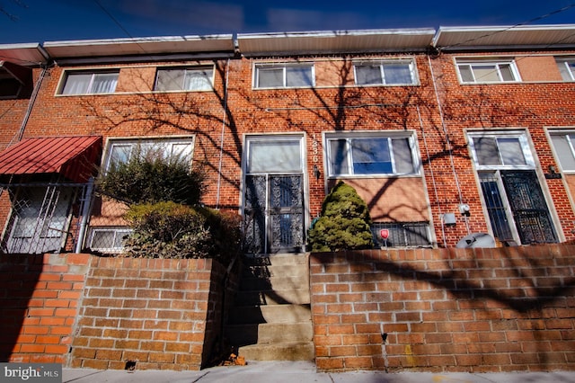 view of property with brick siding