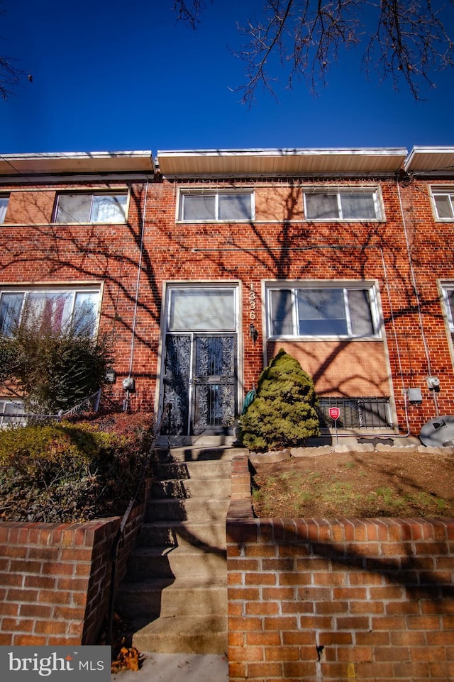 view of front of house with brick siding