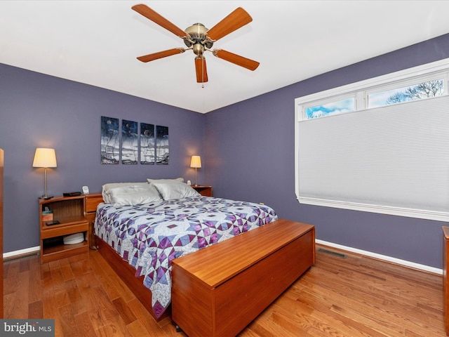 bedroom featuring hardwood / wood-style flooring and ceiling fan