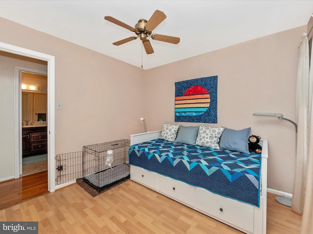 bedroom featuring hardwood / wood-style flooring and ceiling fan