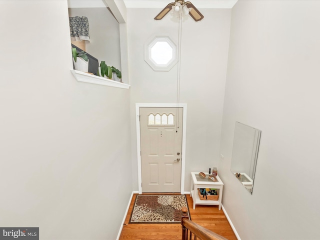 doorway to outside featuring hardwood / wood-style flooring and ceiling fan