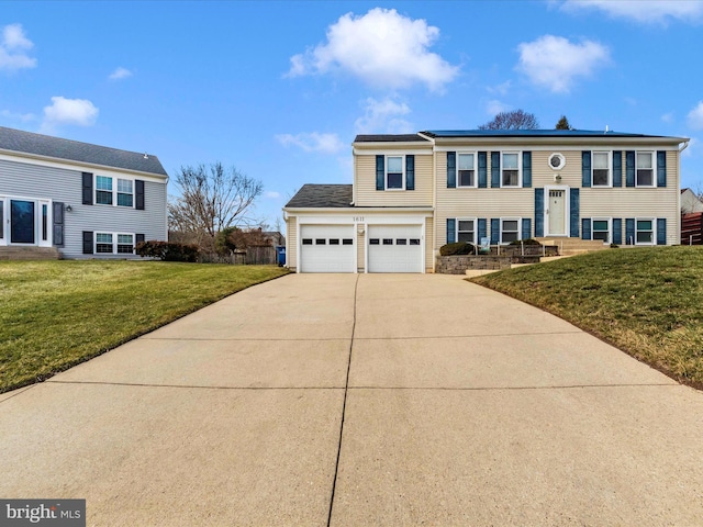 bi-level home with a garage and a front lawn