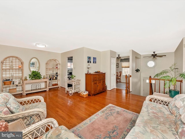 living room with hardwood / wood-style floors and ceiling fan