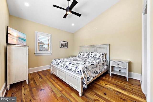 bedroom with lofted ceiling, dark wood-type flooring, and ceiling fan