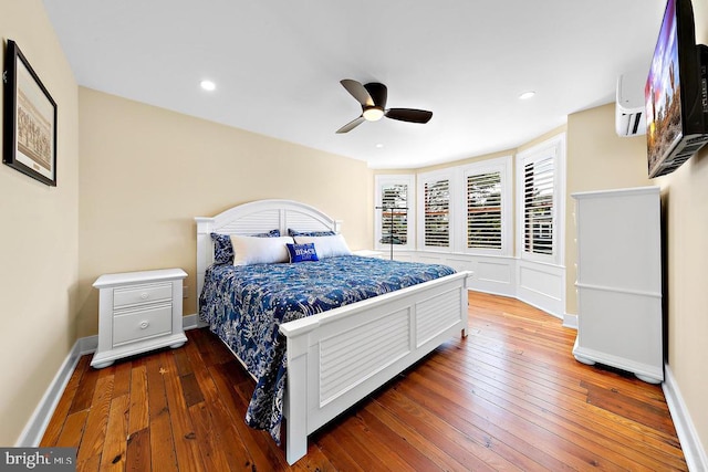 bedroom with ceiling fan and dark hardwood / wood-style floors