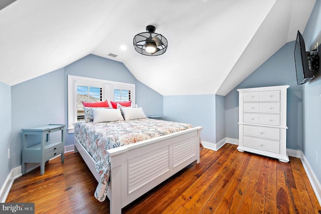 bedroom featuring dark hardwood / wood-style floors and vaulted ceiling