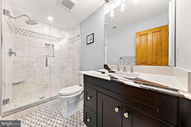 bathroom featuring vanity, an enclosed shower, tile patterned floors, and toilet