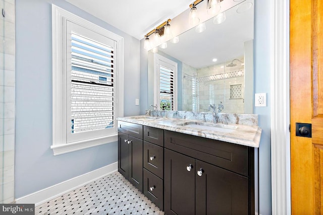 bathroom featuring vanity, tiled shower, and tile patterned floors