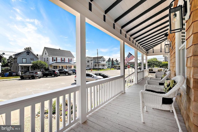 wooden terrace featuring covered porch