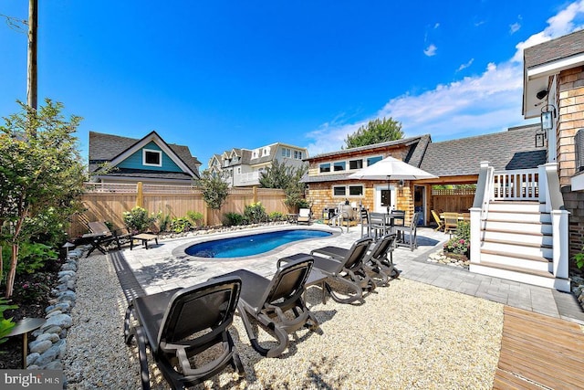 view of pool with a patio and a deck