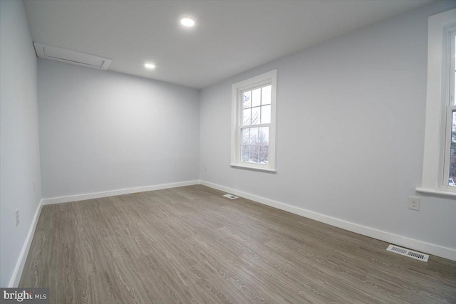 unfurnished room featuring hardwood / wood-style floors