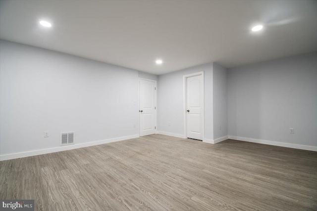 basement featuring hardwood / wood-style floors