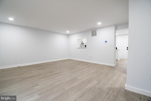 unfurnished room featuring light hardwood / wood-style flooring