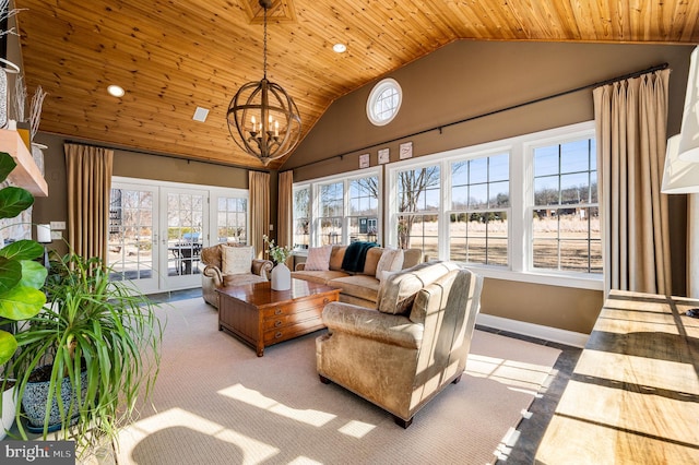 sunroom featuring vaulted ceiling, wood ceiling, and a notable chandelier