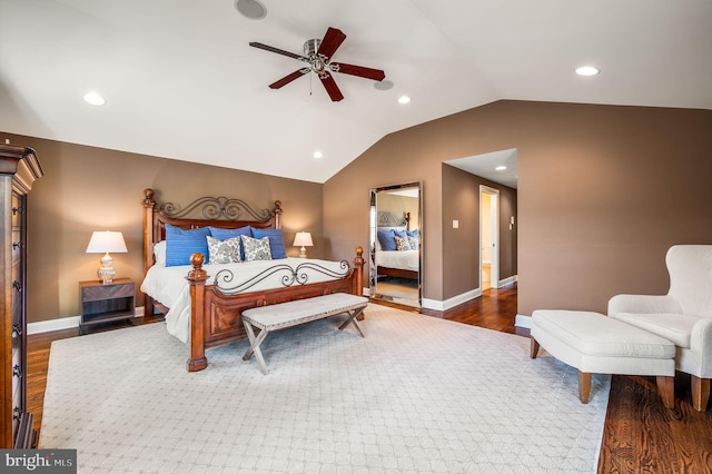 bedroom featuring vaulted ceiling, wood finished floors, and recessed lighting