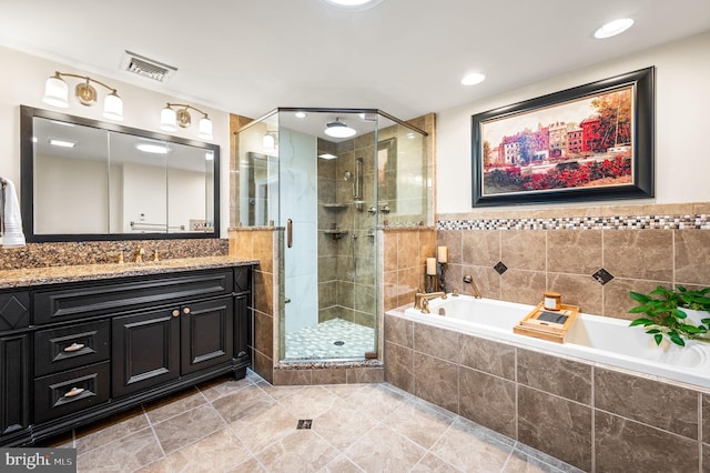 full bath featuring vanity, visible vents, a bath, tile patterned floors, and a stall shower