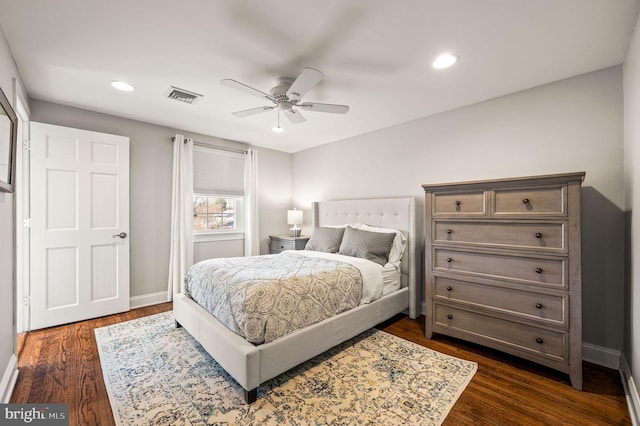 bedroom with dark wood-style floors, recessed lighting, visible vents, and baseboards