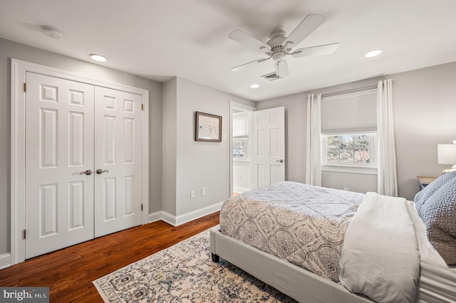 bedroom featuring recessed lighting, dark wood-type flooring, visible vents, baseboards, and a closet