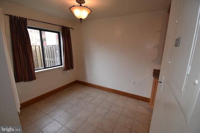 empty room featuring light tile patterned floors