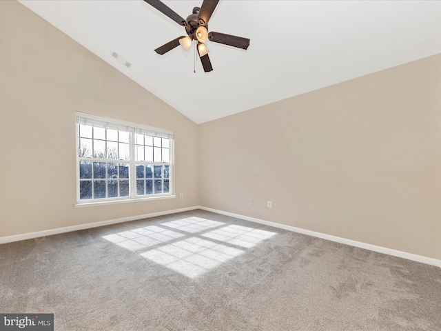 carpeted empty room with ceiling fan and high vaulted ceiling