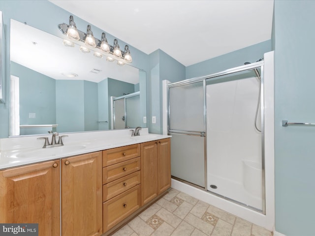 bathroom with walk in shower and vanity