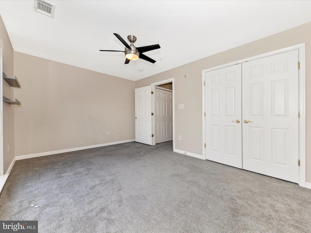 unfurnished bedroom with carpet floors, a closet, and ceiling fan