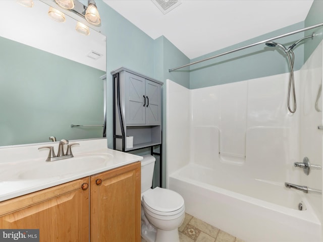 full bathroom with vanity, tile patterned floors, toilet, and washtub / shower combination