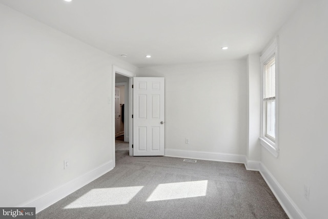 unfurnished room featuring carpet floors