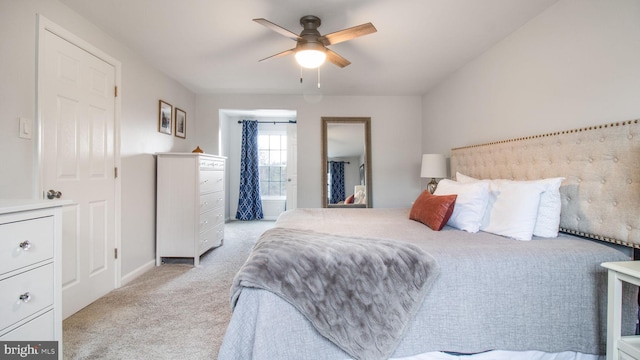 bedroom with ceiling fan and light colored carpet