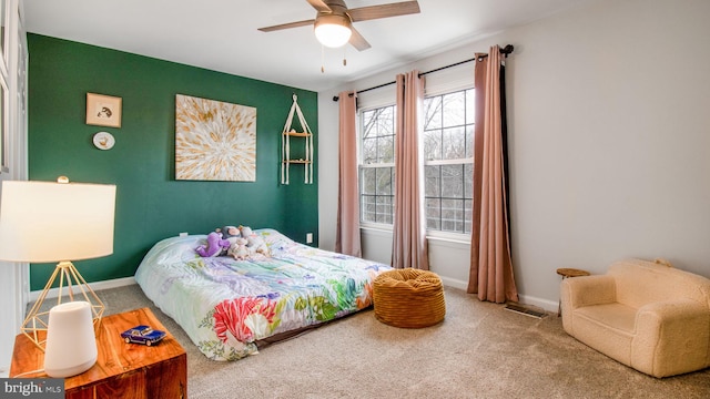 carpeted bedroom with ceiling fan