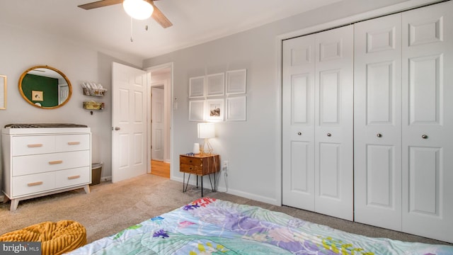 carpeted bedroom featuring ceiling fan and a closet