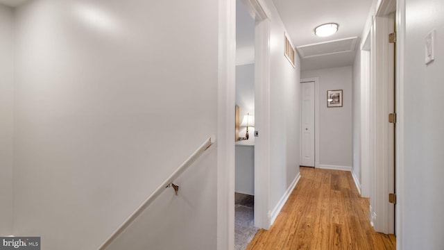 hall with light hardwood / wood-style floors