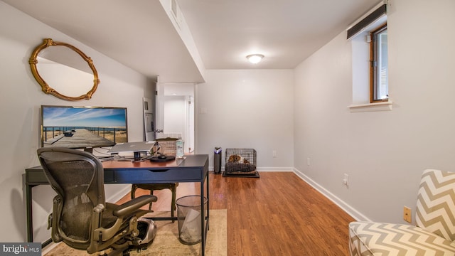 office area with wood-type flooring