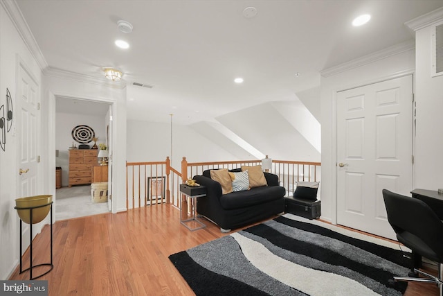 office featuring crown molding, vaulted ceiling, and light hardwood / wood-style floors