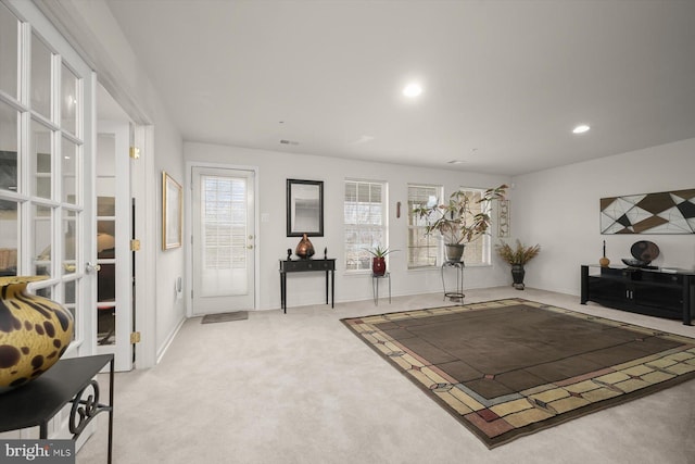 interior space featuring light colored carpet