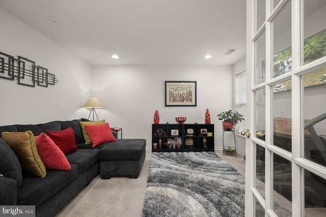 carpeted living room with french doors