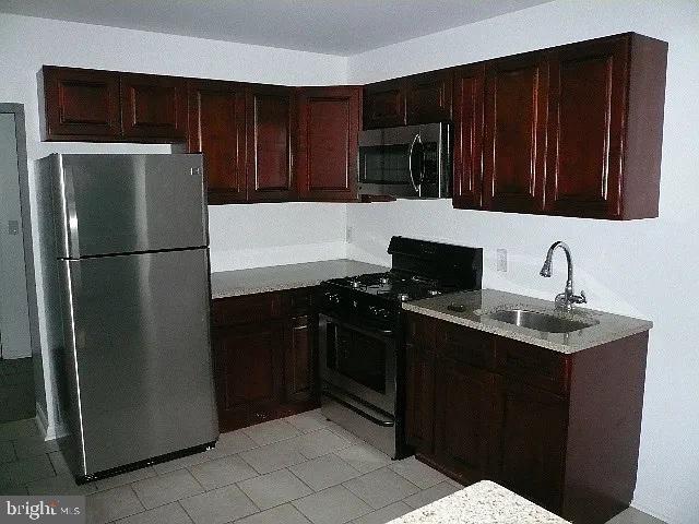 kitchen featuring sink and appliances with stainless steel finishes