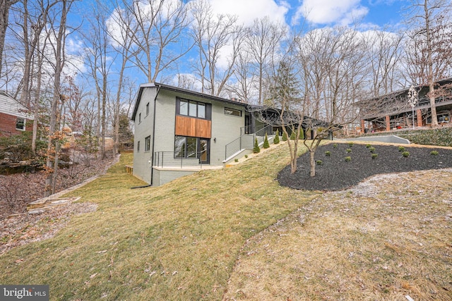 rear view of property featuring a yard